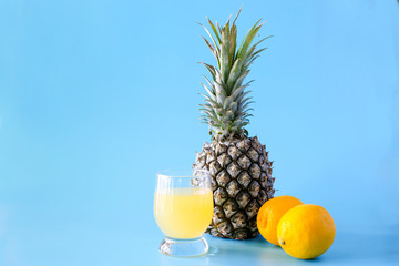 Summer exotic fruits on blue background