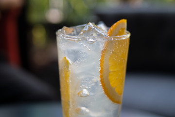 Orange citrus lemonade with ice drink tropical fruit beverage for summer or refreshment and healthy