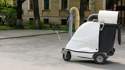 Garbage-cleaning appliances on the street of the city