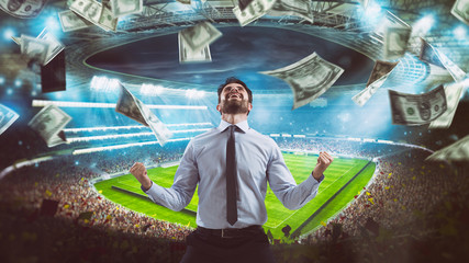 Man who rejoices at the stadium for winning a rich soccer bet - obrazy, fototapety, plakaty