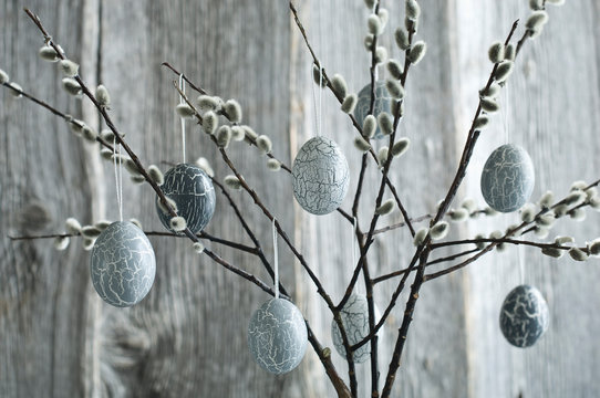 Hand-painted Easter eggs hanging from Pussy Willow twigs