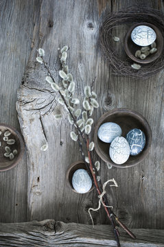 Hand-painted Easter eggs, Pussy Willow twigs and cloth on wood