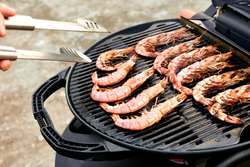 Grilled big tiger shrimps prawns on grill pan, top view. Grilled seafood. Barbecue shrimps..