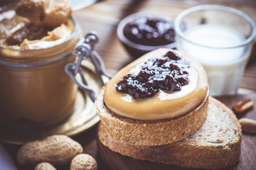 Peanut Butter and Jelly on Rustic Wood Cutting Board. Homemade Healthy Breakfast.