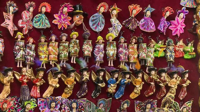 Close-up still shot of small coloured cultural and traditional toys at a shop, San Blas