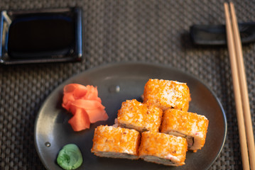 set of California rolls on dark background