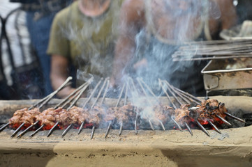 Chicken seekh kababs are being prepared road side