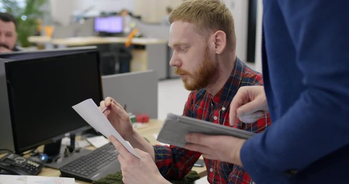 Boss supervises employee and provides guidance to help him