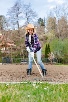 Young woman raking