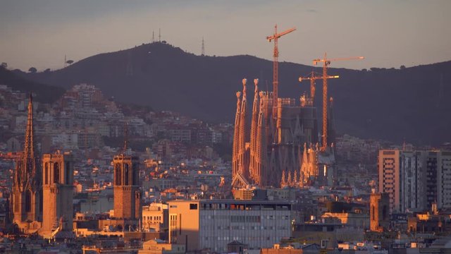 Sagrada familia and panorama view of Barcelona city at dusk ,Spain in 4k