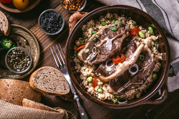 Roasted Lamb Loin Chops with Soybean and Couscous in Rustic Dish