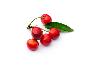 bunch of red ripe sweet cherries on a white background