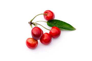 bunch of red ripe sweet cherries on a white background