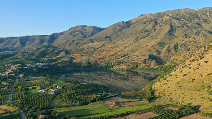 Obraz premium Aerial drone panoramic photo of famous natural lake of Kournas with amazing colours and unique nature surrounded by mountains, Chania prefecture, Crete island, Greece