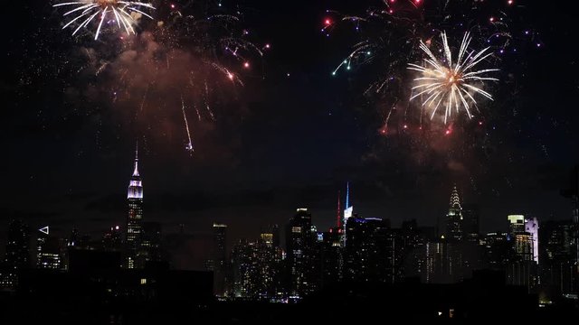Fireworks over New York City skyline, wide