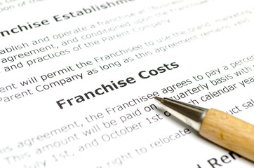 Franchise costs with wooden pen