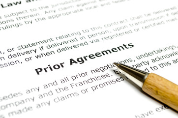 Prior agreements with wooden pen