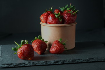 fresh strawberries on a clay pot