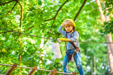Naklejka na ściany i meble Cute child boy playing. Artworks depict games at eco resort which includes flying fox or spider net. Every childhood matters. Toddler age. Children fun