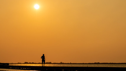 silhouette of a bridge at sunset