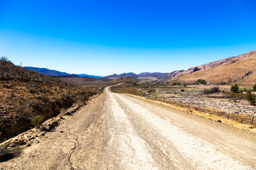 Fototapeta na wymiar Gravel road in rural area South Cape