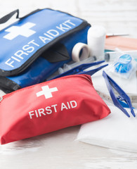 First aid medical kit on wood background,copy space