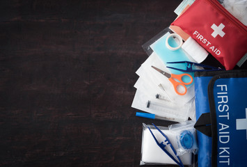 First aid medical kit on wood background,copy space,top view