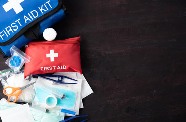 First aid medical kit on wood background,copy space,top view