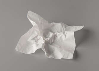 Crumpled tissue paper on gray background