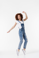 Full length of a cheerful young redhead curly girl