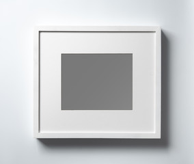 Empty white wood frame with shadow on white background