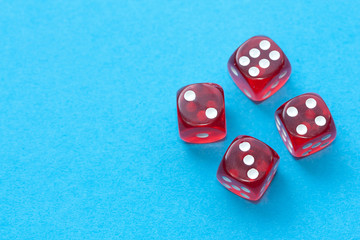 Red dices on blue background.