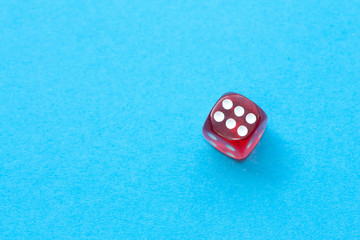 Red dice on blue background.