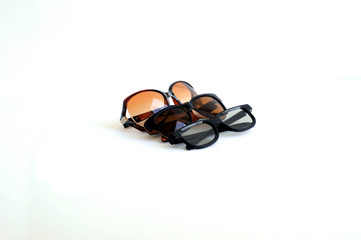 Three sunglasses on a white background. Space for text.