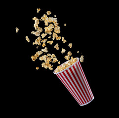 Popcorn flying out of the package isolated on black background