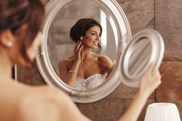 Beautiful bride preparing herself