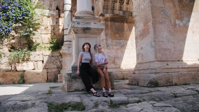 Two girls tourist enjoying old city view. Travel guide, tourism in Europe with friends.