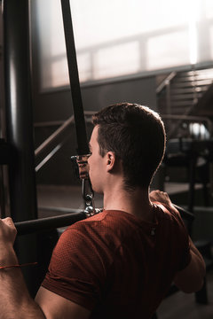 Young fitness man training in gym