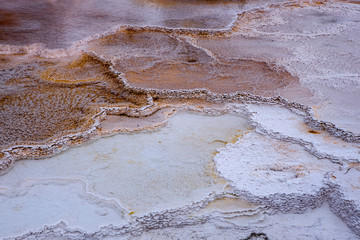 Water in terraced mineral deposit sections.