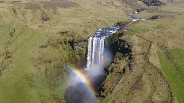 Aerial, rainbow over waterfall in Iceland