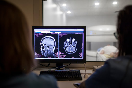 Doctors baling the MRI test in the control room