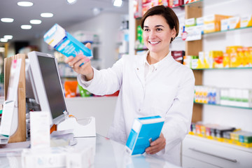 Pharmacist ready to assist in choosing at counter