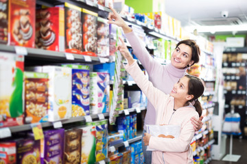 Family shopping for breakfast cereal