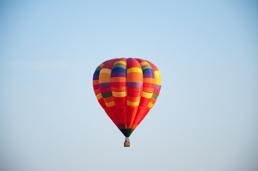 Big balloon. Balloon. Colorful bowl with basket. In the sky soars in the summer