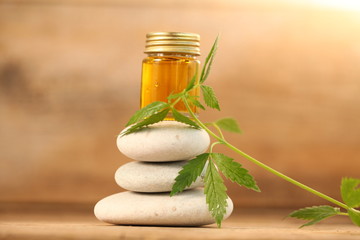 cbd oil bottle and hemp leaf . medical cannabis