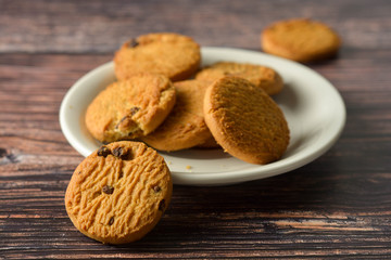 Oat and Chocolate chip cookies on rustic wooden table background