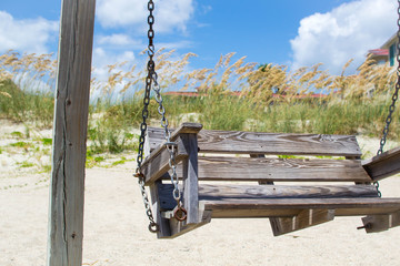 Front view of bench swing on the beach