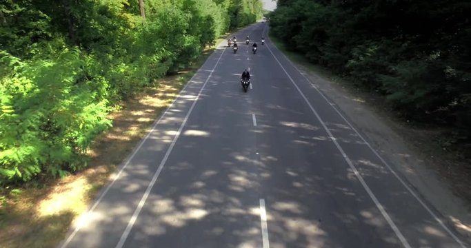 Motorcycle motorcade on a forest road