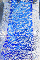 Macro Close Up of Inside a Paperweight Bubbles Glass Blue Water
