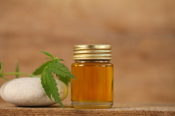 cbd oil bottle and hemp leaf . medical cannabis
